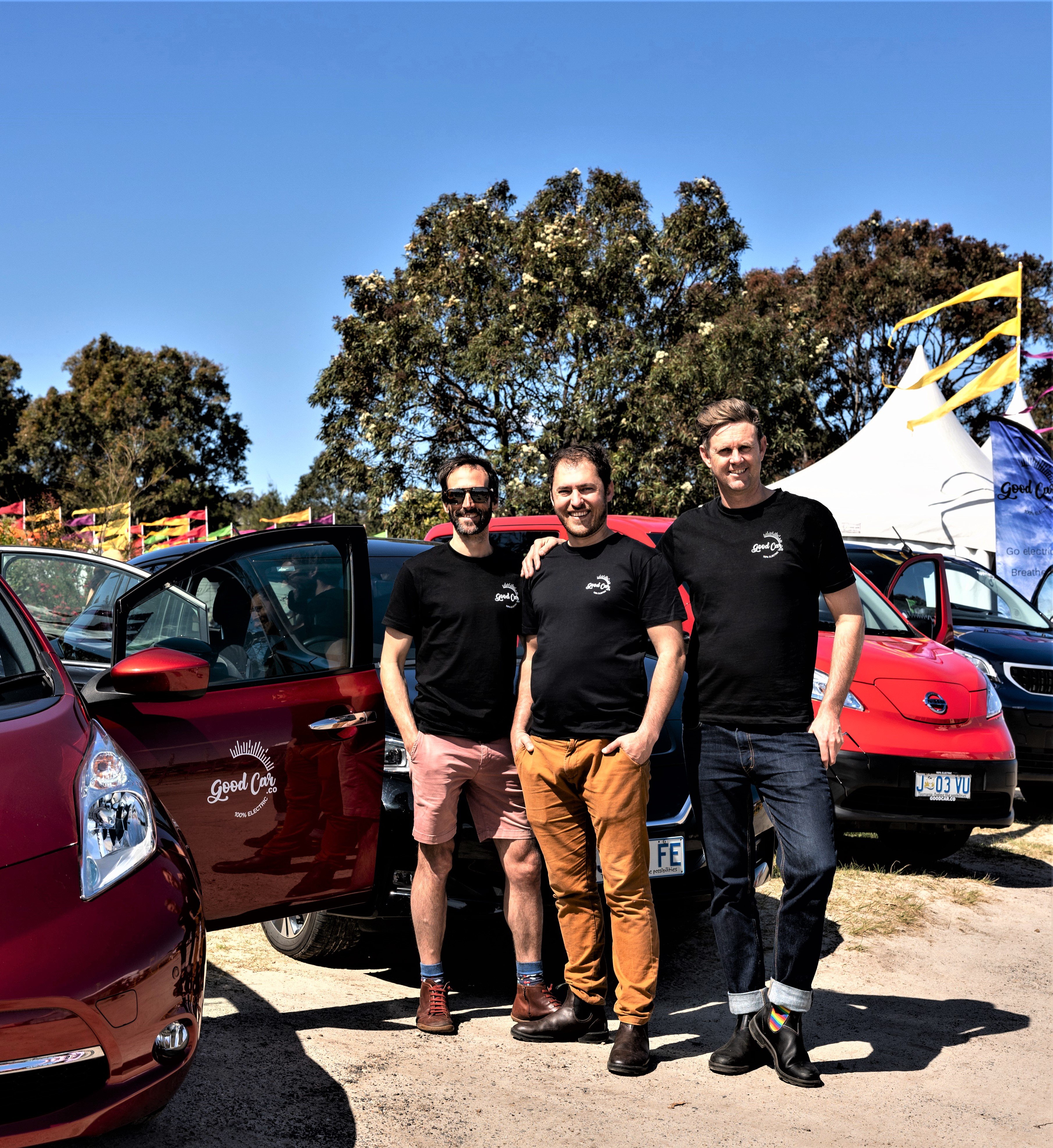 3 directors closer group red car door